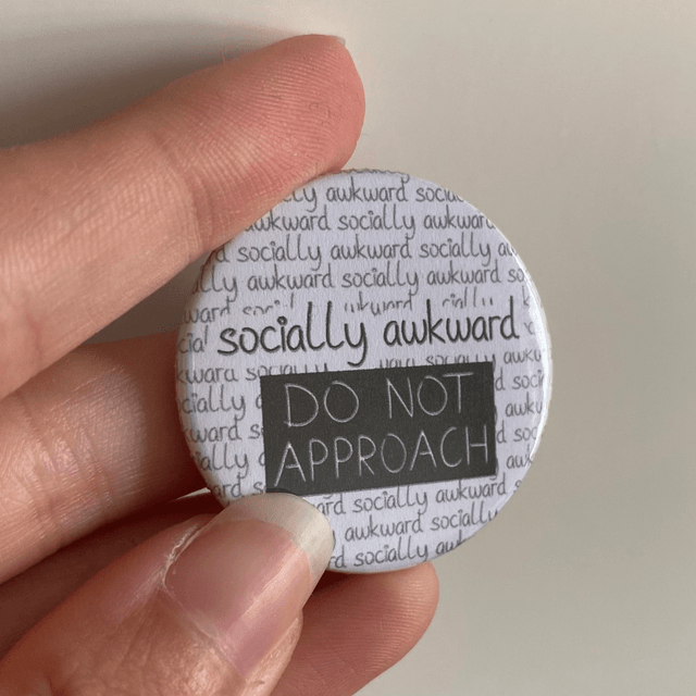 M: socially awkward (button small)